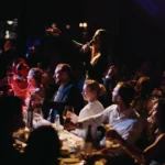 Guests watching a live performance during dinner at El Porteño Prohibido