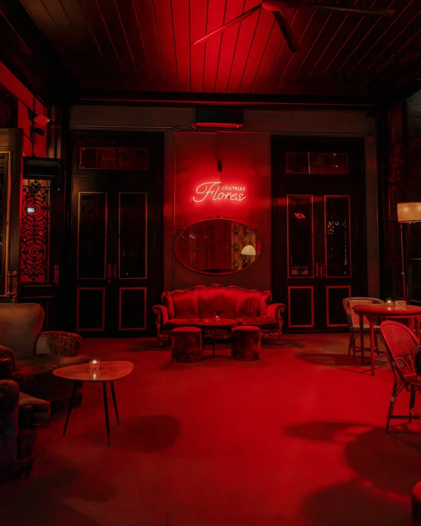 Red-lit lounge area at El Porteño Prohibido