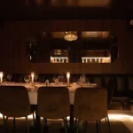 Elegant dining room with candlelit tables at Giulia Ristorante Paris