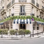 Giulia Ristorante Paris exterior with striped awning and outdoor seating