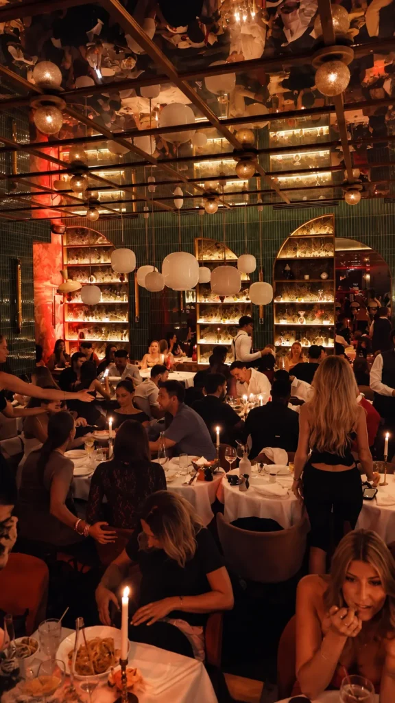 Warmly lit dining room inside Giulia Ristorante Paris