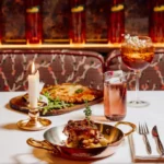 Italian dishes and a cocktail served at Giulia Ristorante Paris
