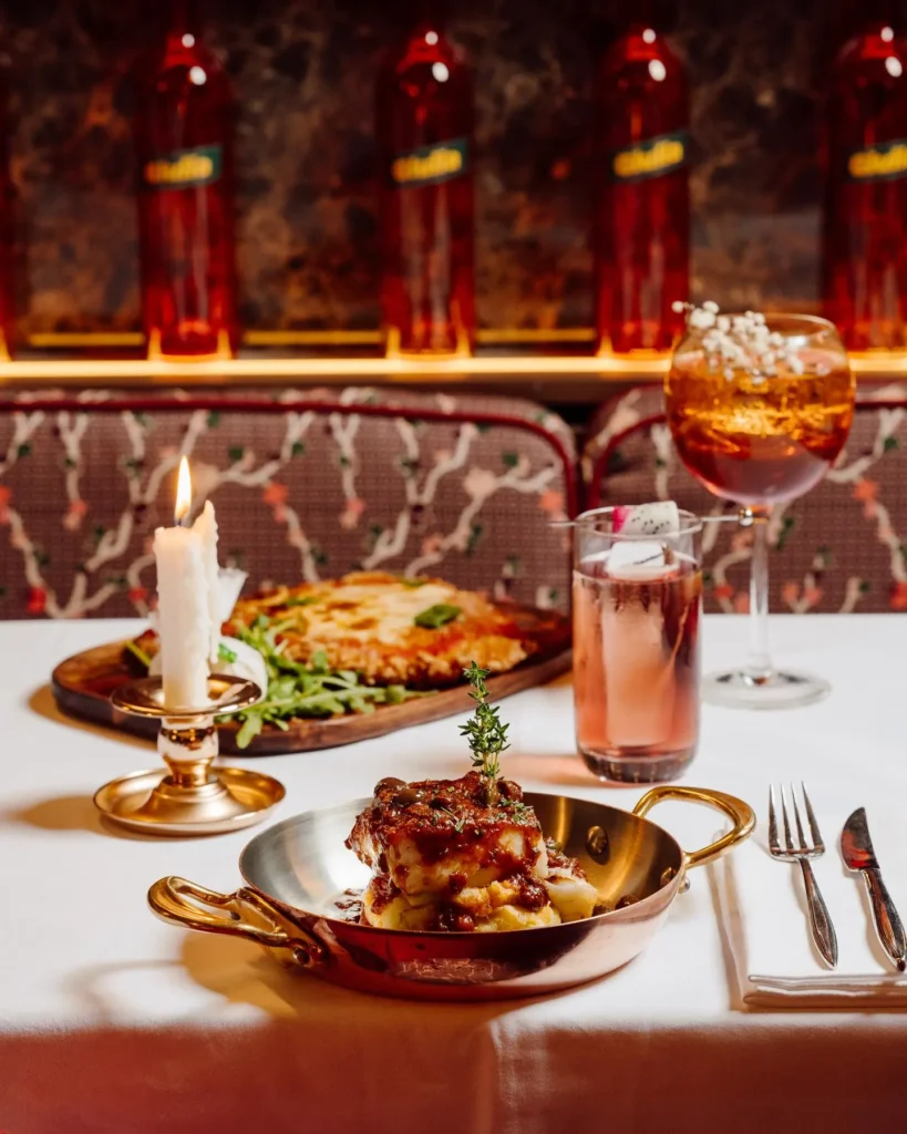 Italian dishes and a cocktail served at Giulia Ristorante Paris