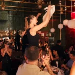 Guest dancing among diners during an evening at Giulia Ristorante Paris