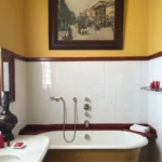 Classic bathroom with a freestanding bathtub at Hotel Costes Paris