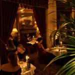 Candlelit restaurant seating at Hotel Costes in Paris