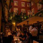 Busy evening dining in the courtyard at Hotel Costes in Paris