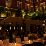 Hotel Costes courtyard illuminated at night in Paris