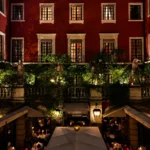 Hotel Costes courtyard restaurant surrounded by classic Parisian architecture