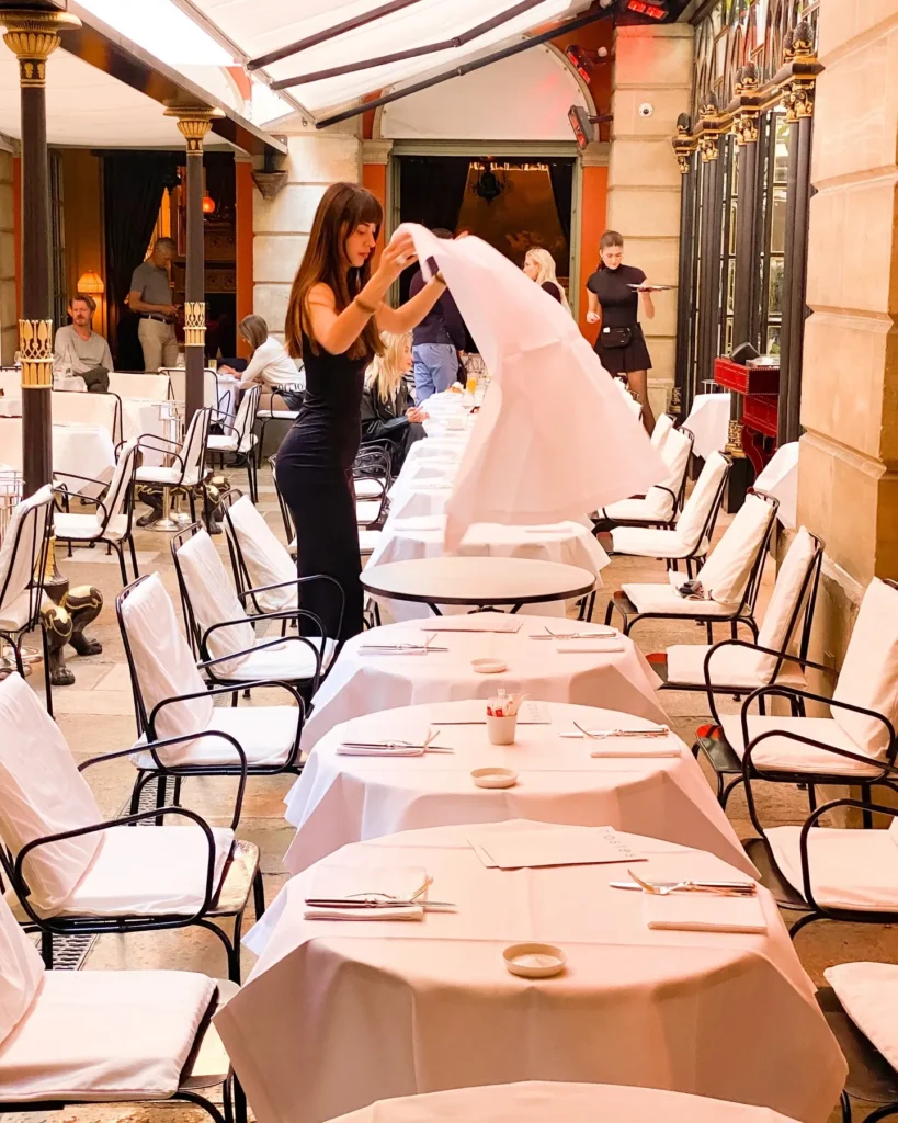 Elegant covered dining terrace at Hotel Costes in Paris