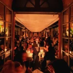 Lively evening dining on the covered terrace at Hotel Costes