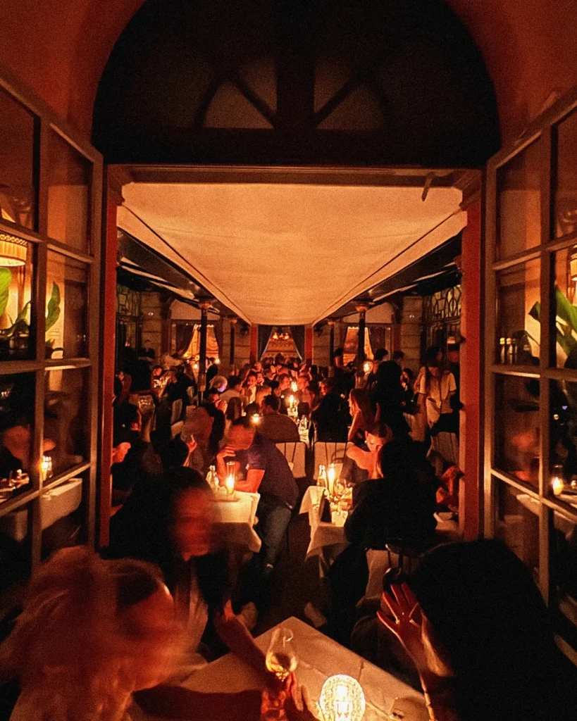Lively evening dining on the covered terrace at Hotel Costes