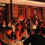 Guests dining in the elegant interior of Hotel Costes in Paris