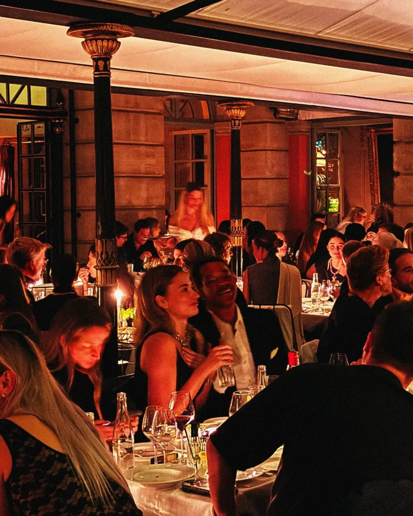 Guests dining in the elegant interior of Hotel Costes in Paris