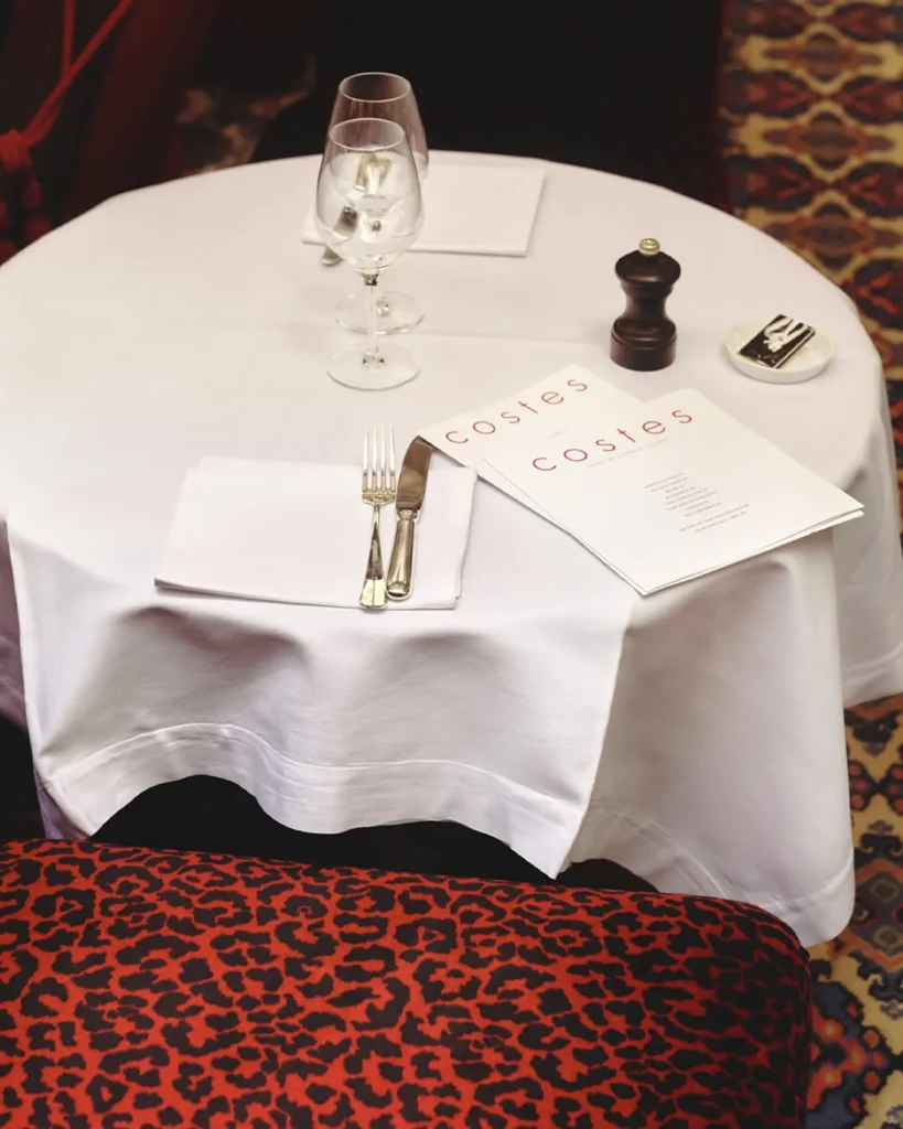 Elegant dining table prepared at Hotel Costes in Paris