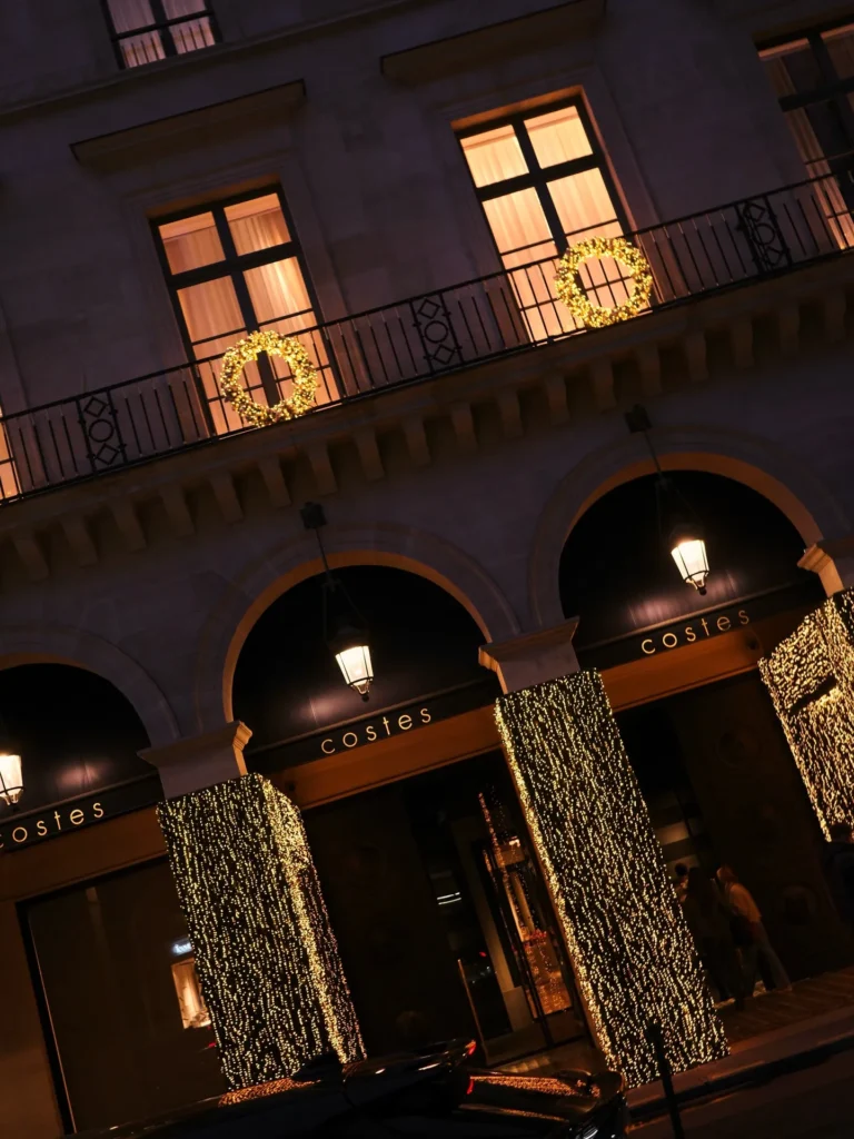 Hotel Costes facade illuminated at night in Paris