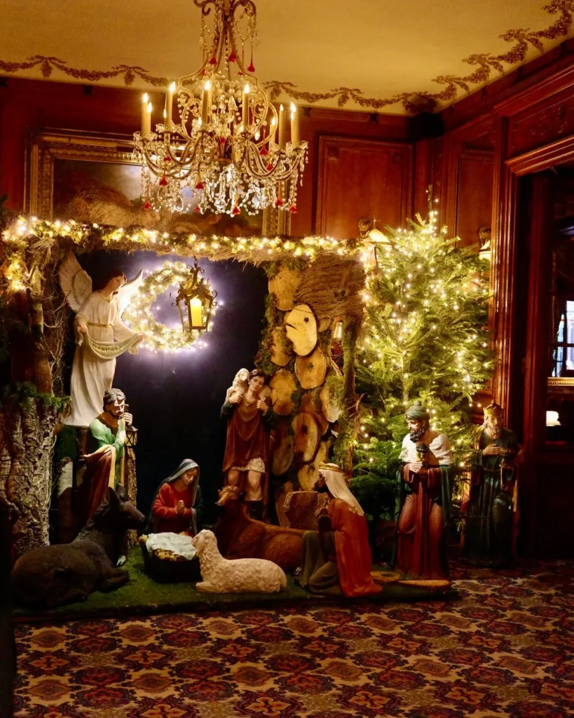 Festively decorated interior with a chandelier at Hotel Costes Paris