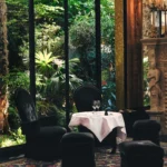Garden-facing dining room at Hotel Costes in Paris