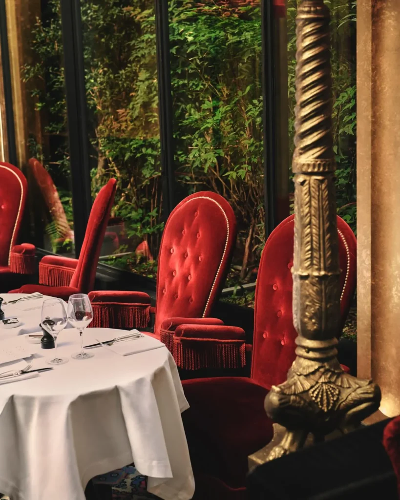 Garden restaurant seating at Hotel Costes in Paris