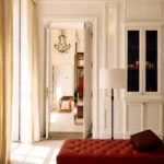 Elegant sunlit hallway with classic decor at Hotel Costes Paris
