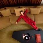 Guest relaxing on a sofa in the luxurious interior of Hotel Costes