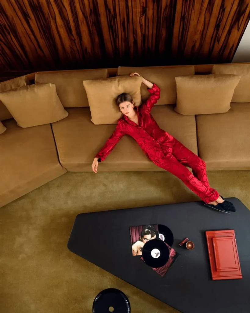 Guest relaxing on a sofa in the luxurious interior of Hotel Costes