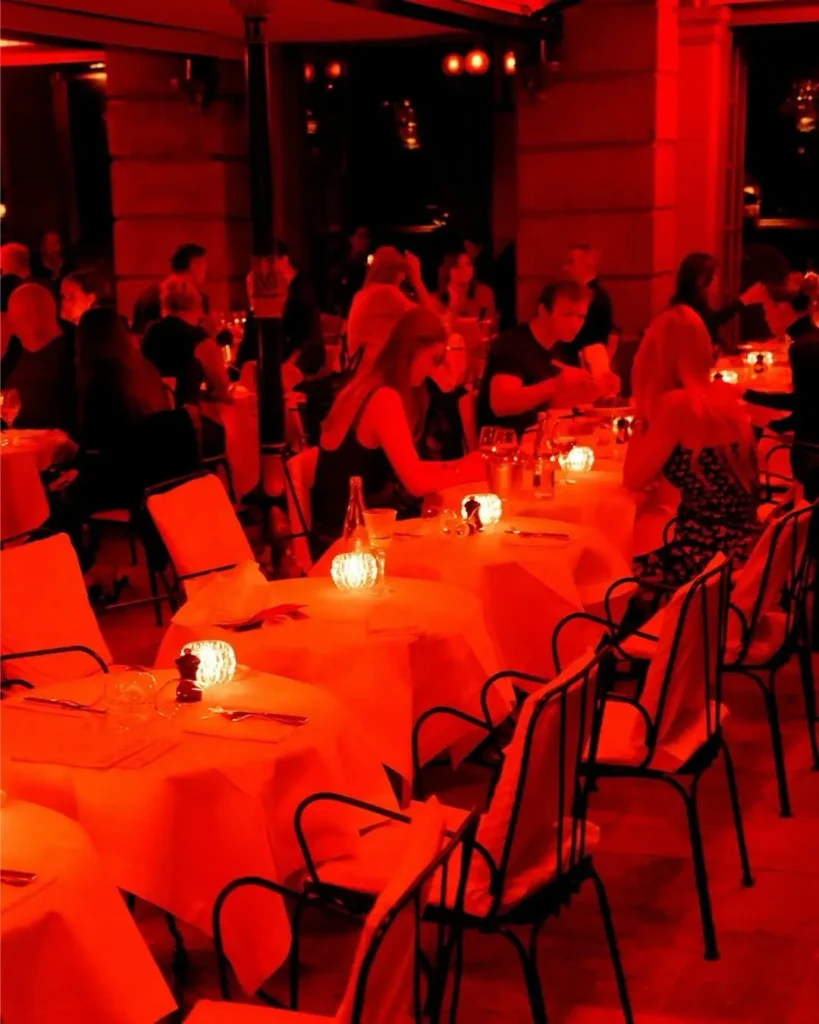 Red-lit dining room at Hotel Costes in Paris
