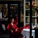 Guest relaxing at the elegant outdoor restaurant terrace of Hotel Costes