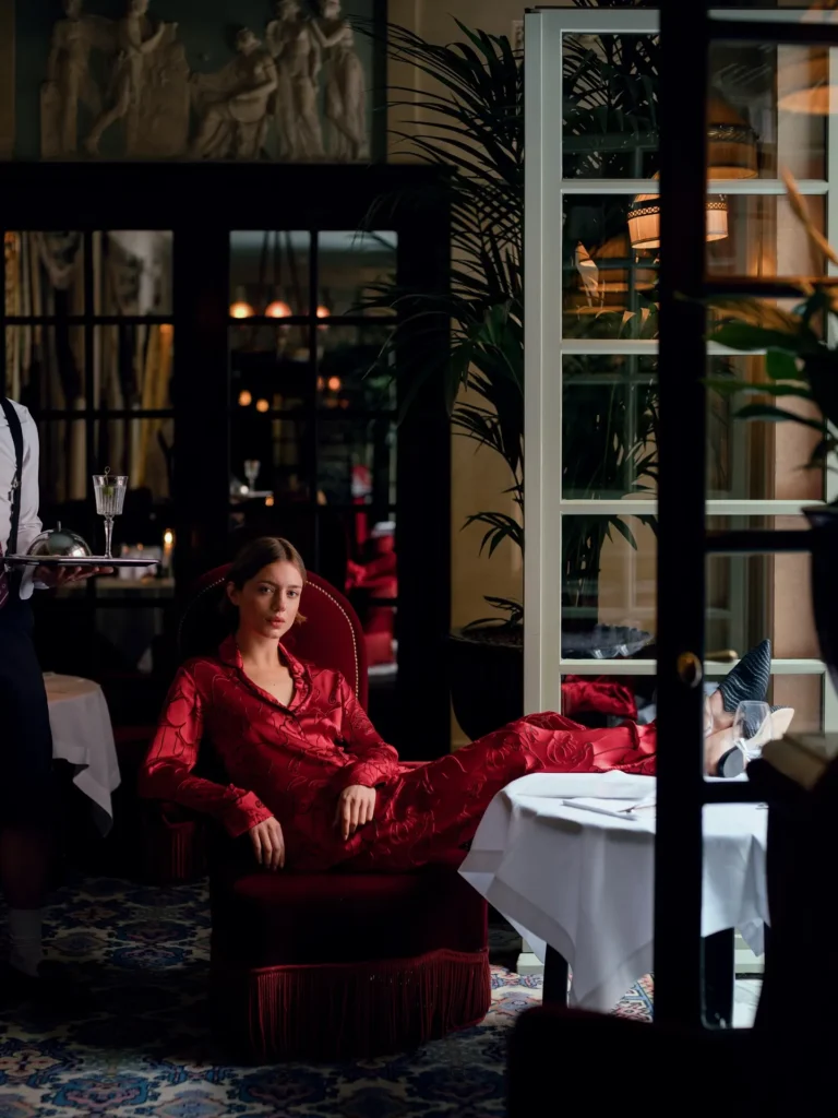 Guest relaxing at the elegant outdoor restaurant terrace of Hotel Costes
