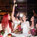 Guests celebrating with drinks at JustMe Milano