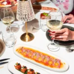 Guests enjoying a dinner party at JustMe Milano