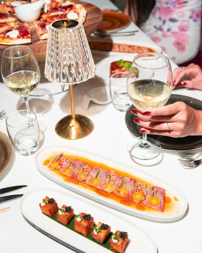 Guests enjoying a dinner party at JustMe Milano