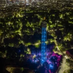 Aerial night view of JustMe Milano and its illuminated surroundings