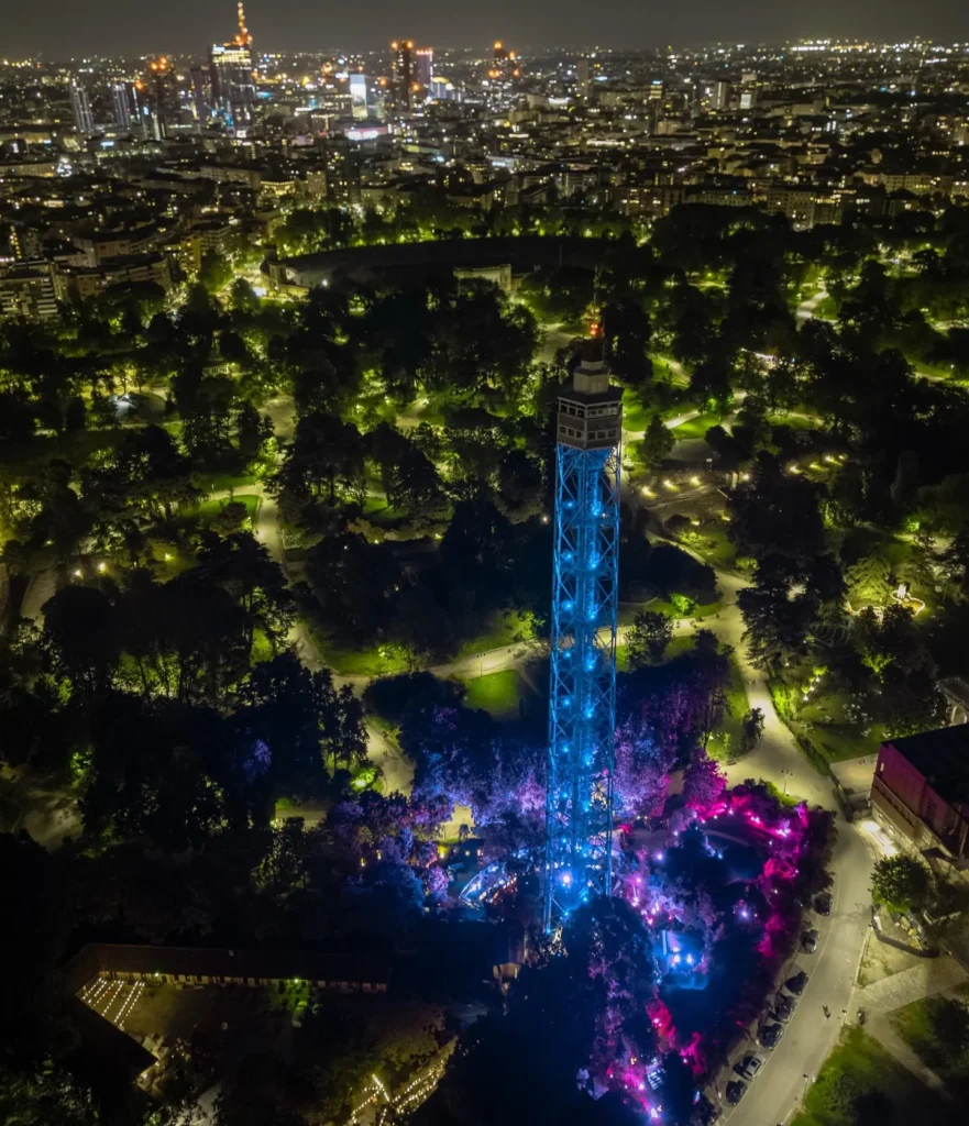 Aerial night view of JustMe Milano and its illuminated surroundings