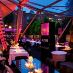 Colorful restaurant interior with tables and purple lighting at JustMe Milano