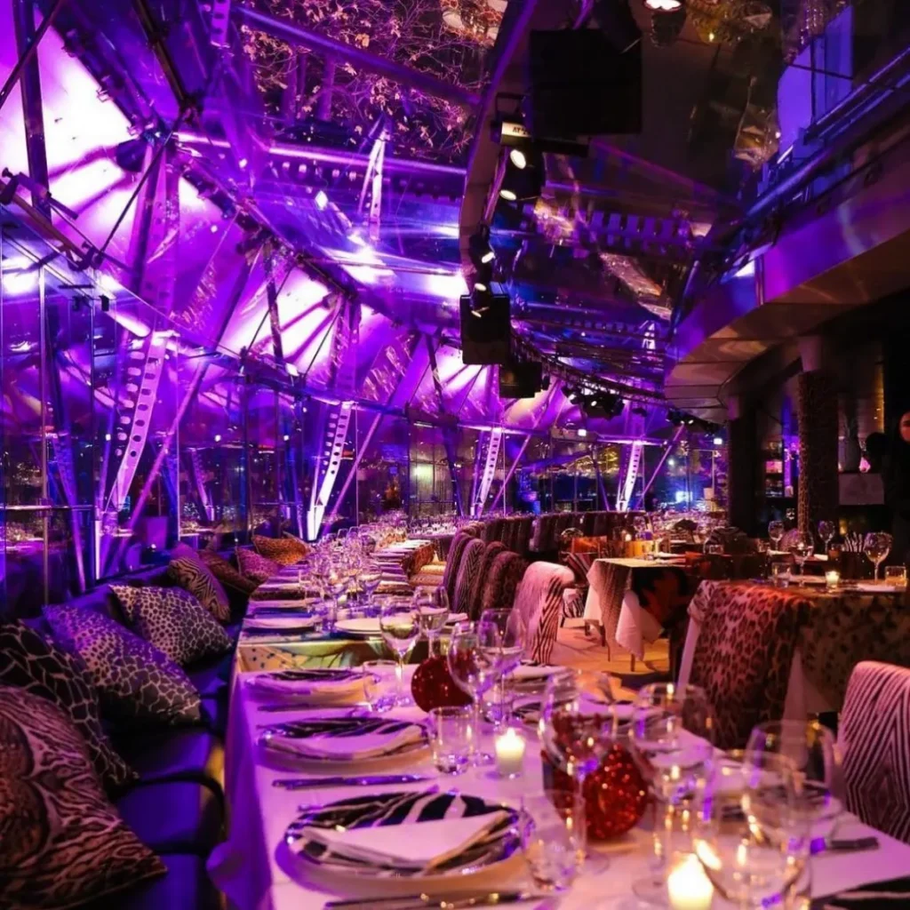 Vibrant restaurant interior with illuminated tables at JustMe Milano