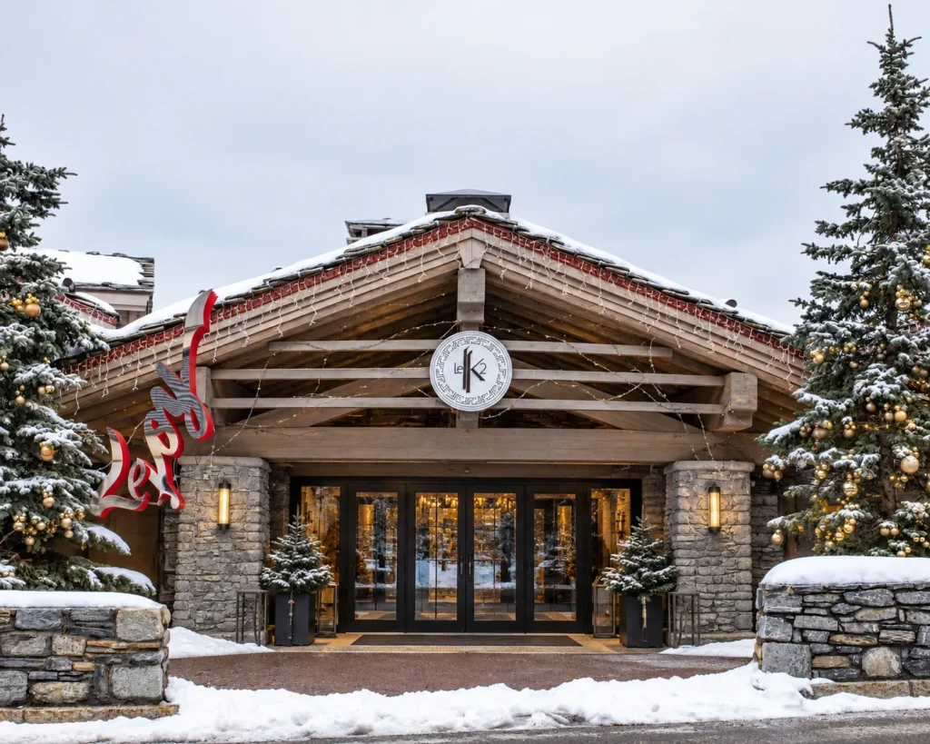 Snow-covered exterior of K2 Palace in Courchevel