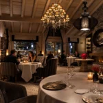 Warmly lit fine dining room at K2 Palace Courchevel