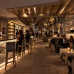 Luxury restaurant interior with stone and wood details at K2 Palace Courchevel