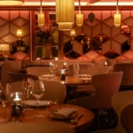 Warmly lit dining interior at Kinugawa Rive Gauche