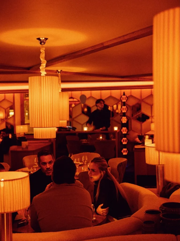 Guests dining in the warmly lit interior of Kinugawa Rive Gauche