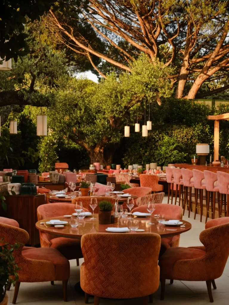 Outdoor dining area surrounded by greenery at Kinugawa Rive Gauche