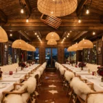 Elegant dining room with pendant lights at La Ferme Saint-Amour Courchevel