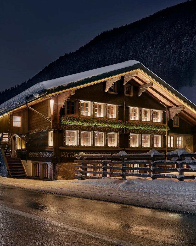 Snow-covered exterior of La Ferme Saint-Amour Courchevel