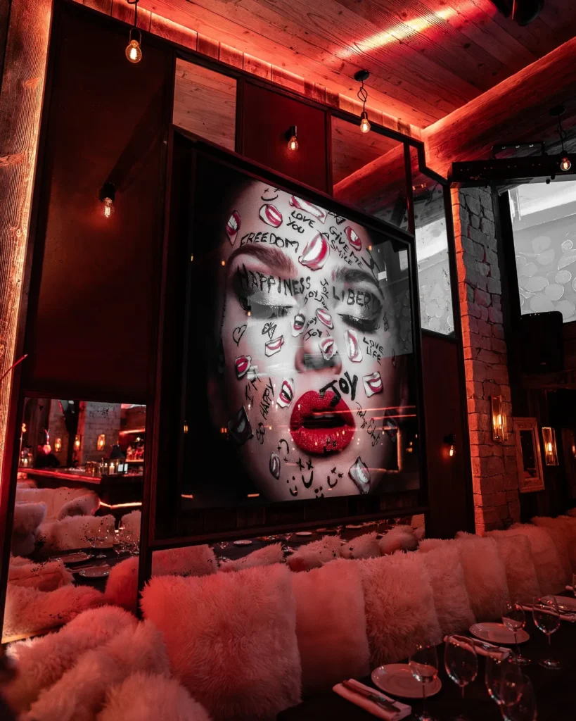 Luxurious lounge interior with artwork at La Ferme Saint-Amour Courchevel