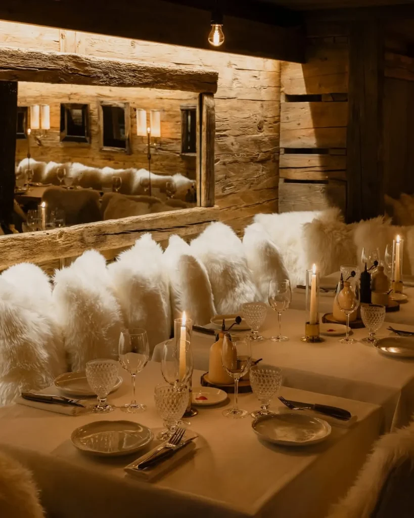 Warmly lit restaurant interior at La Ferme Saint-Amour Courchevel