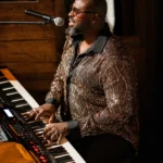 Live pianist performing inside La Ferme Saint-Amour Courchevel