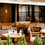 Outdoor restaurant terrace at La Ferme Saint-Amour Courchevel