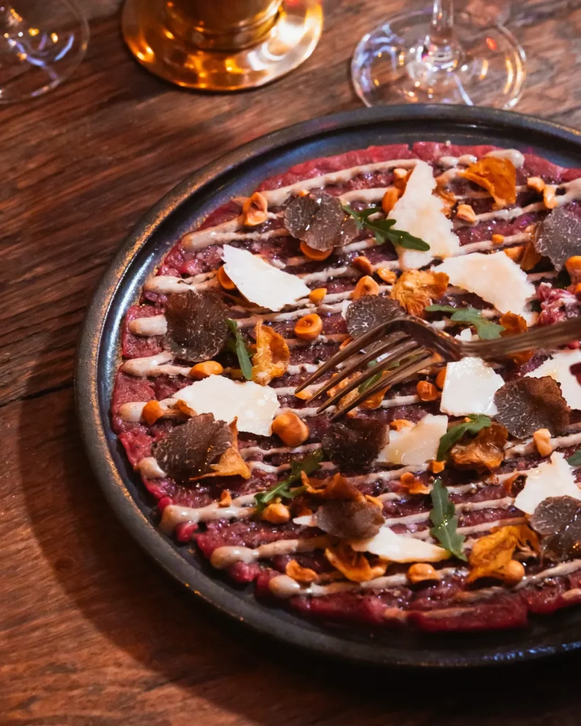 Gourmet pizza served at La Ferme Saint-Amour Courchevel