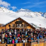Crowd enjoying après-ski on the terrace at La Folie Douce Méribel